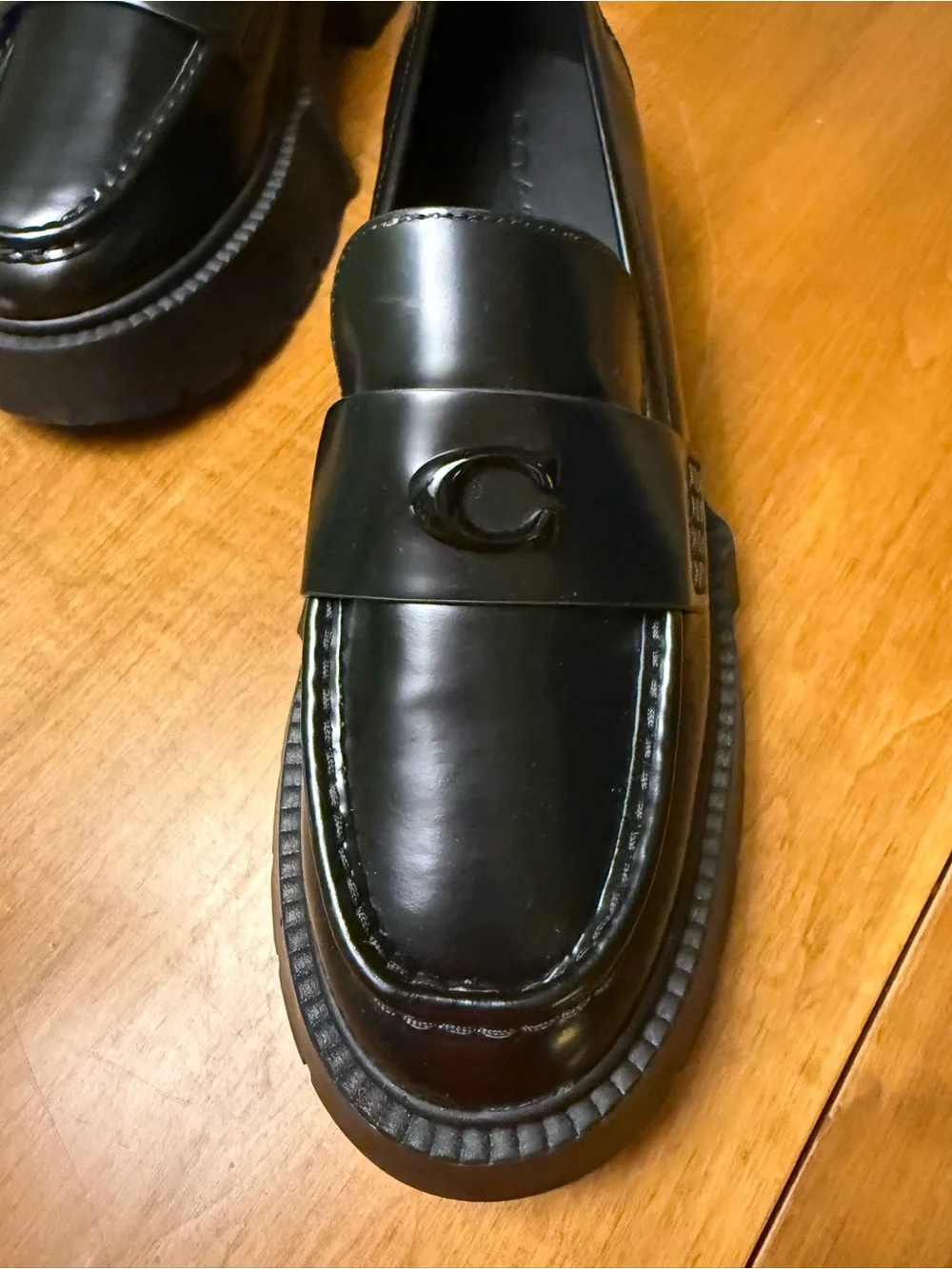 Coach polished black